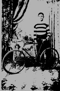 Arthur Churchill with his bike and cycing trophies
